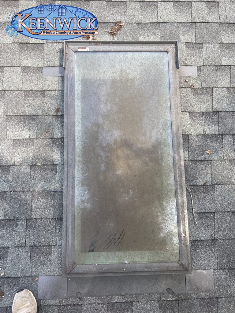 Residential home exterior before Keenwick cleaning services