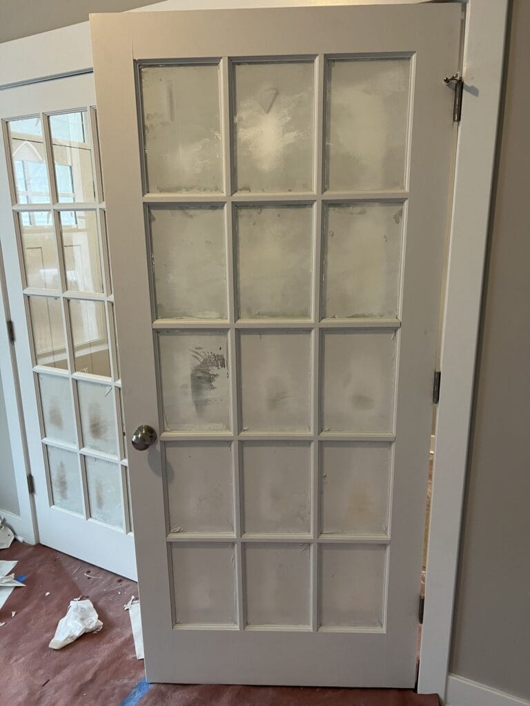 Professional window cleaning and restoration service on residential windows - before